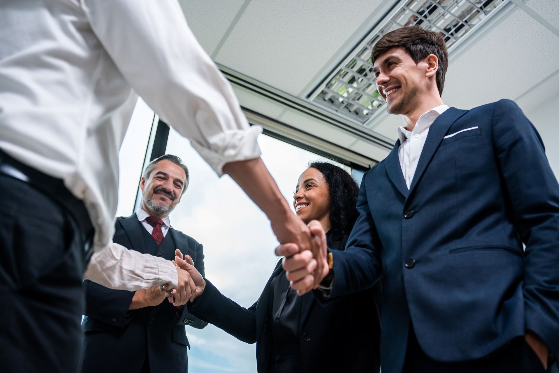 caucasian-businessman-making-a-handshake-together-2025-03-24-23-14-58-utc